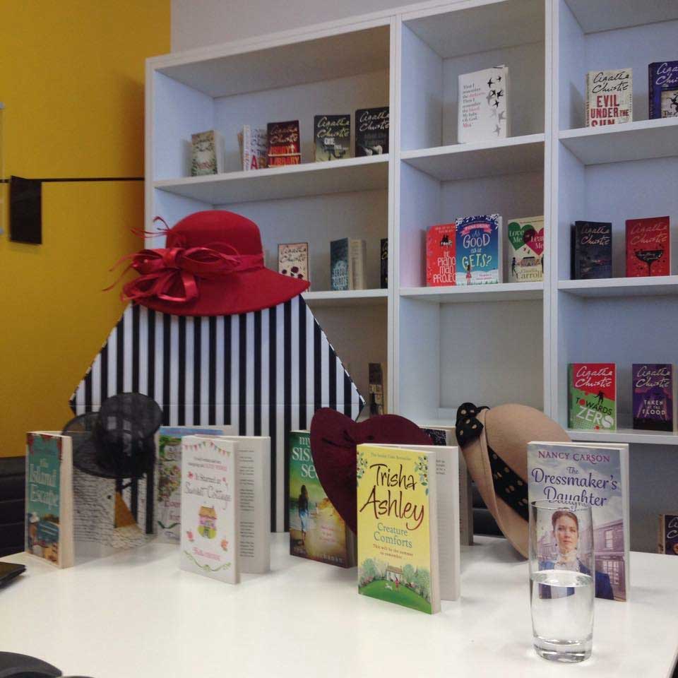 image shows: Welcomed to Avon HarperCollins UK with a display of hats to reflect Ava's millinery talents